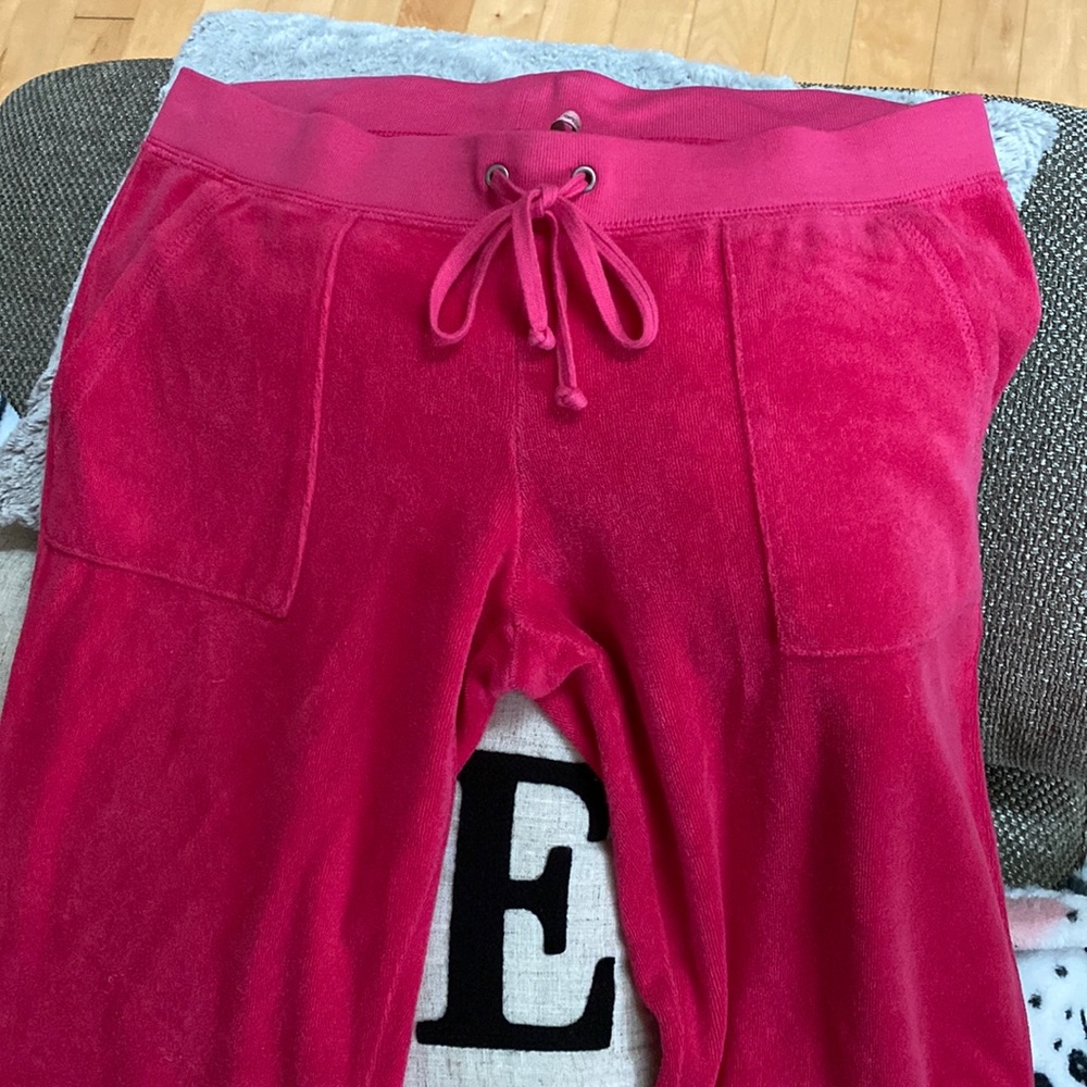 Hot pink juicy track pants with pockets in the front and back